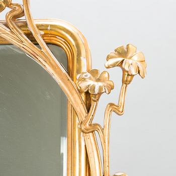 An Art Nouveau mirror with console table from early 20th century.