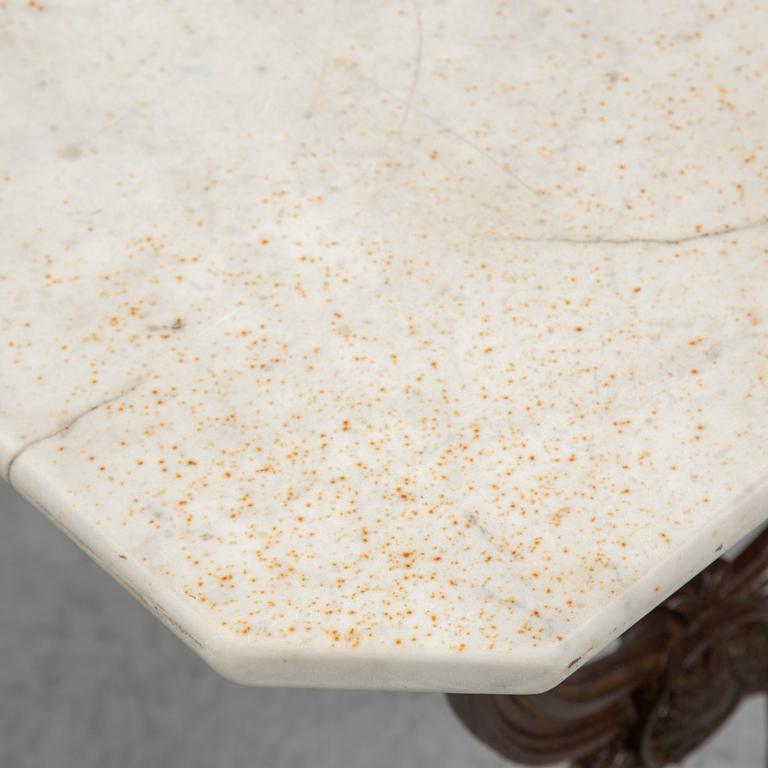 a cast iron and marble table from Corné & Cie Toulouse, around 1900.