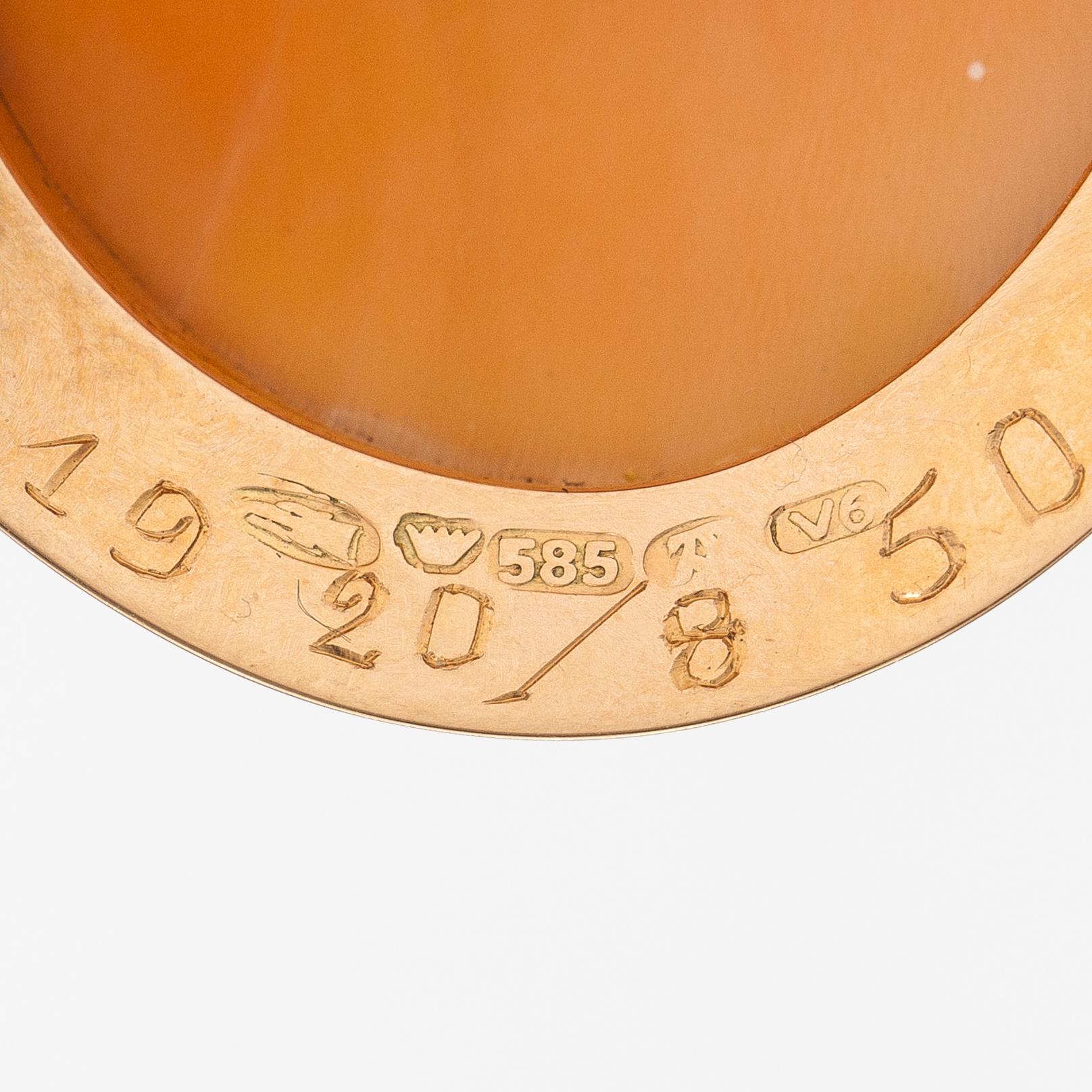 Two brooches and a ring, 14K and 18K gold and sea shell cameos.