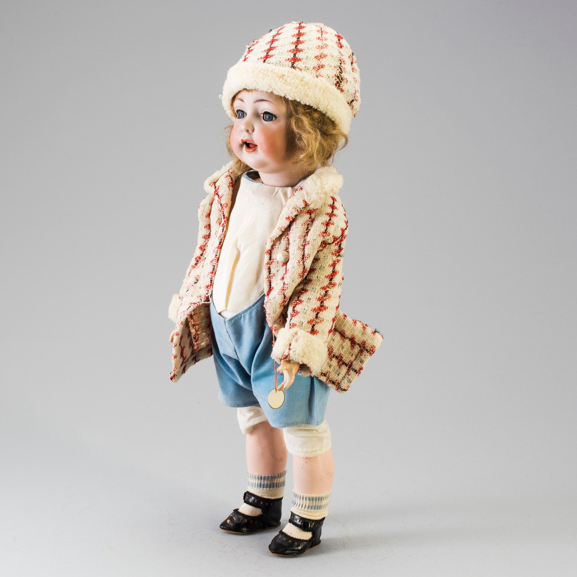 A bisque headed doll, Germany, early 20th century.
