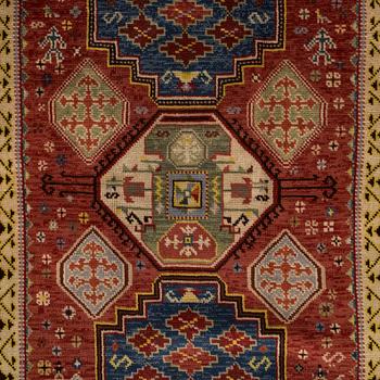 A 1940's Spanish rug Of Kazak design, ca. 139 x 93 cm.