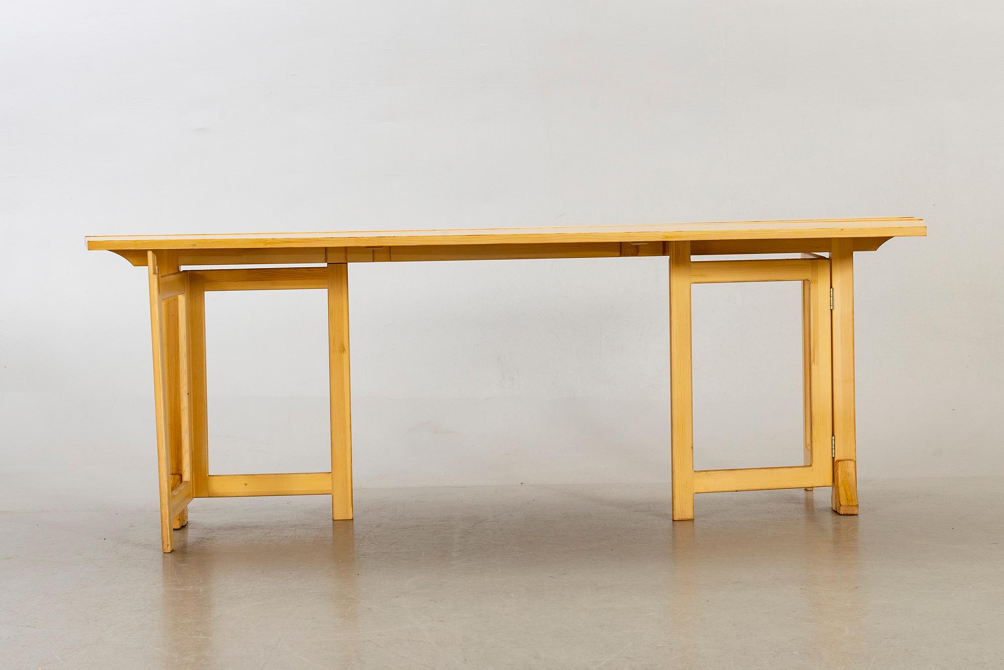 A pine wood gated leg table, design by Olof Pira "Sold Form".