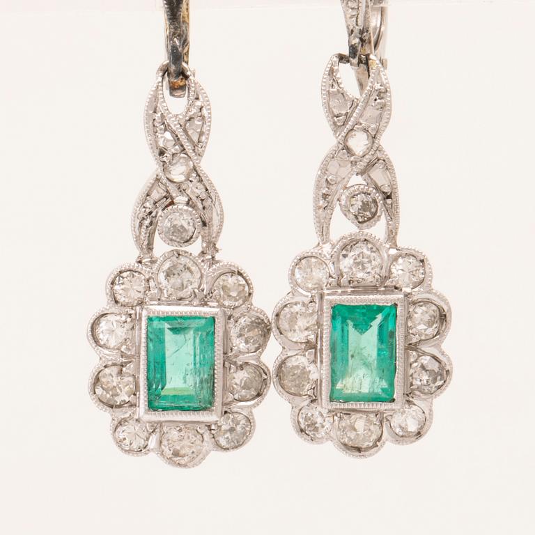 A pair of 18K white gold earrings set with baguette-cut emeralds and various cut diamonds, G. Dahlgren & Co Malmö.