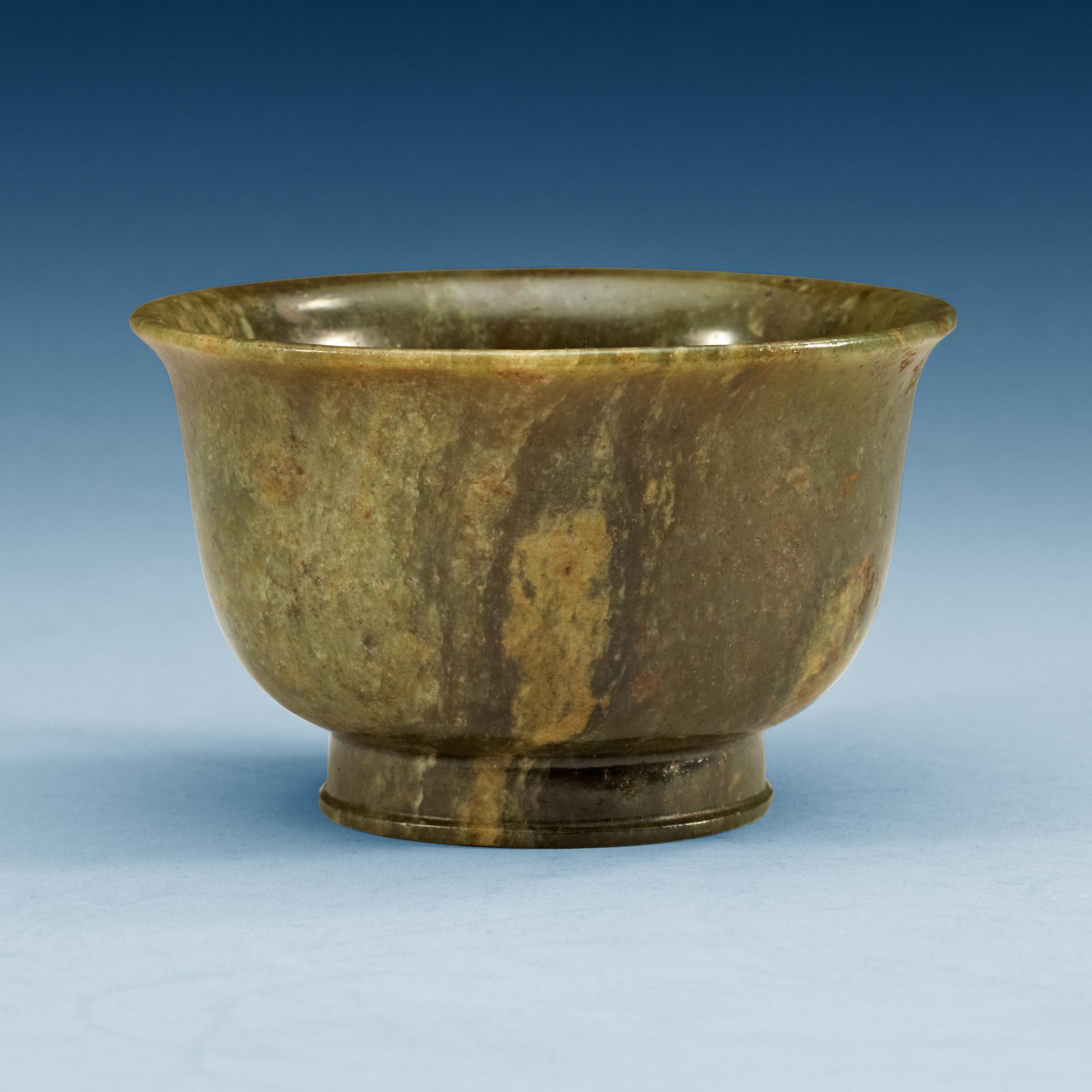 A green marble bowl, Qing dynasty (1644-1912), with Qianlong six character mark.