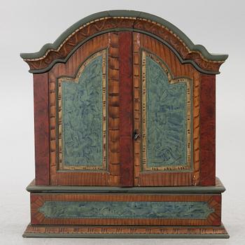 A folk-art cabinet from Värmland, Sweden, dated 1806.