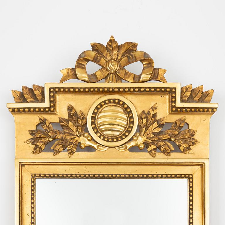 A Gustavian style mirror, mid 20th century.