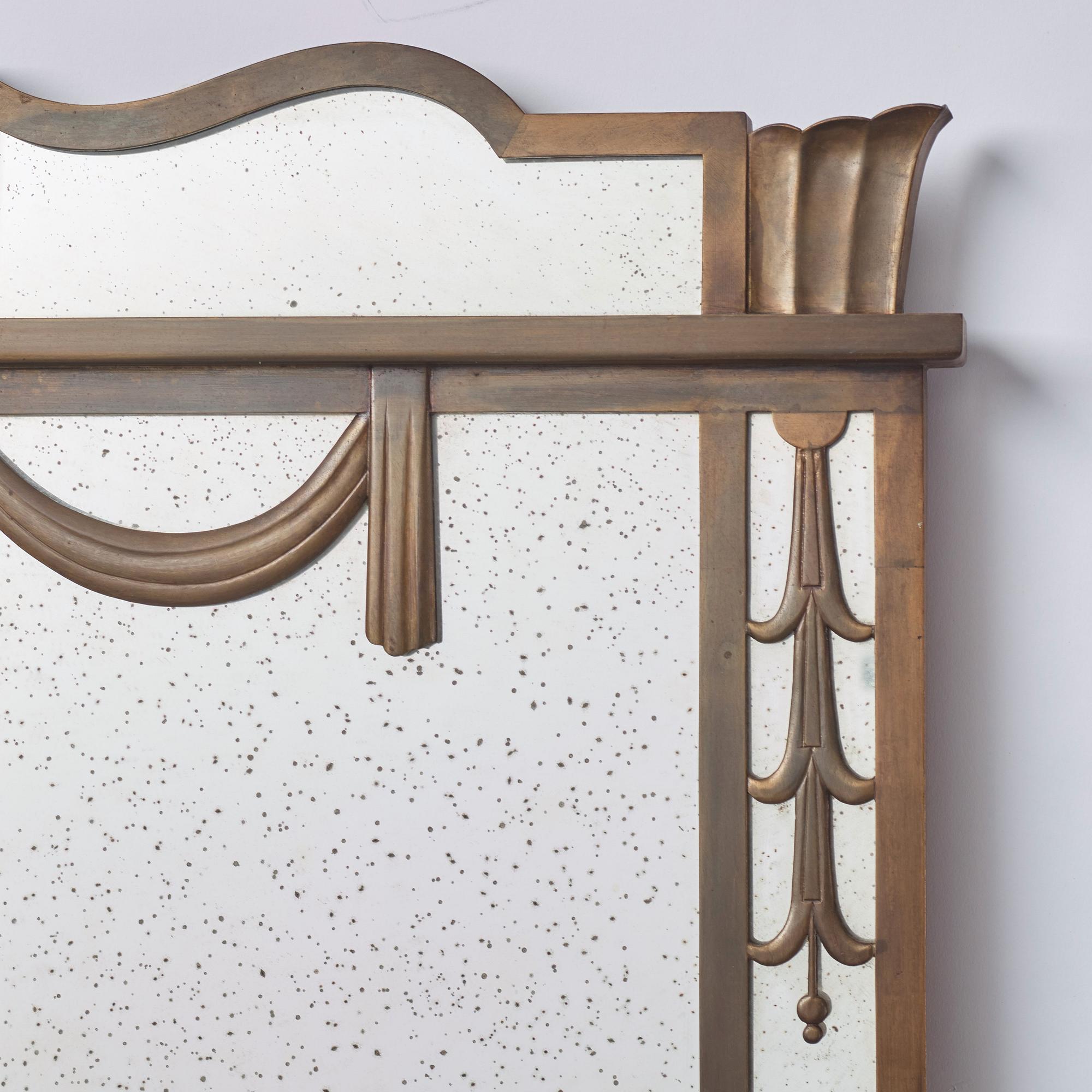 Swedish Grace, a brass framed wall mirror, 1920-30s.