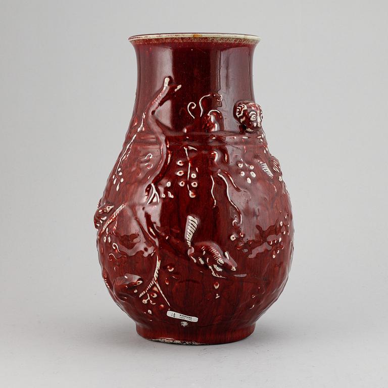 A red glazed Chinese vase, 20th century.