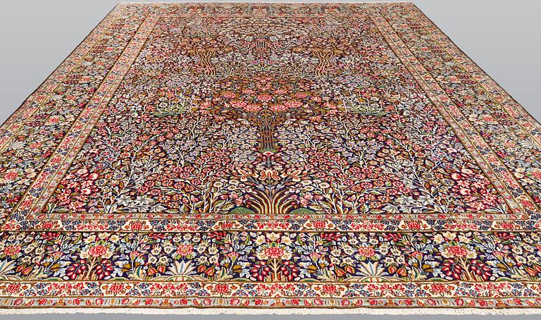 A Kirman Laver carpet, 'Millefleur', approx. 400 x 295 cm.