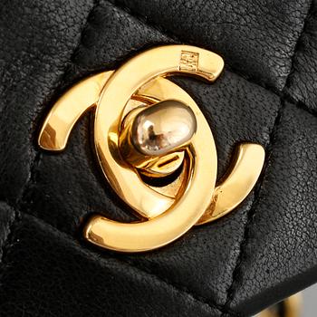 A 'Mini Flap' Chanel lamb skin handbag.