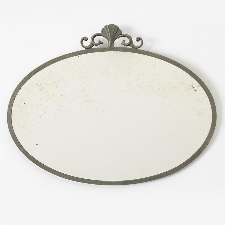 A Swedish Grace pewter mirror, 1920s/30s.