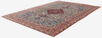 A semi-antique Qum carpet. Central Persia, c. 345 x 258 cm.