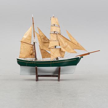 A model of a ship, mid 20th century.