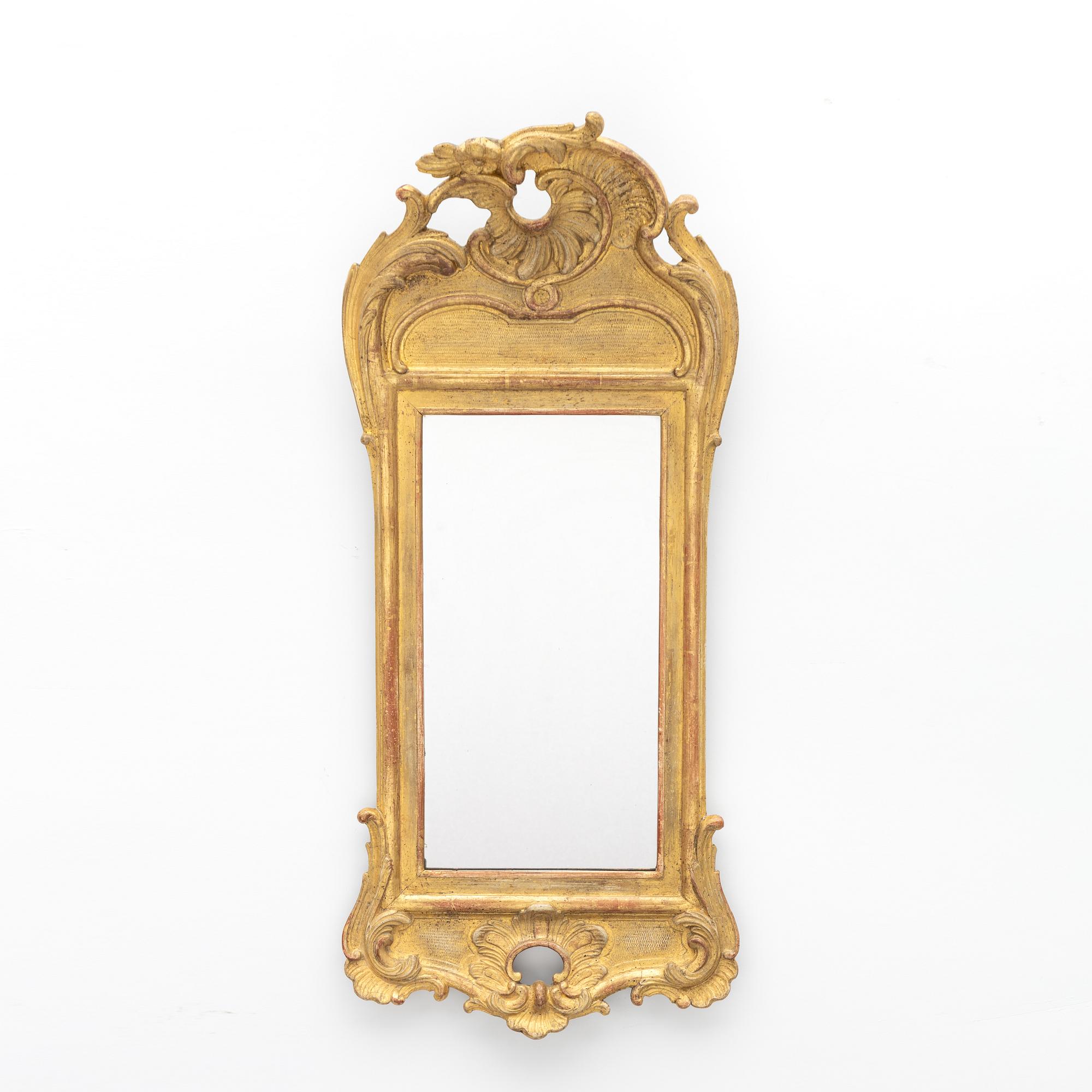 A giltwood rococo mirror, Stockholm, later part 18th century.