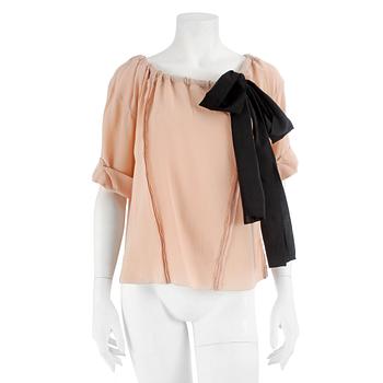 826. PRADA, a powder pink blouse with black ribbon. Size 40.