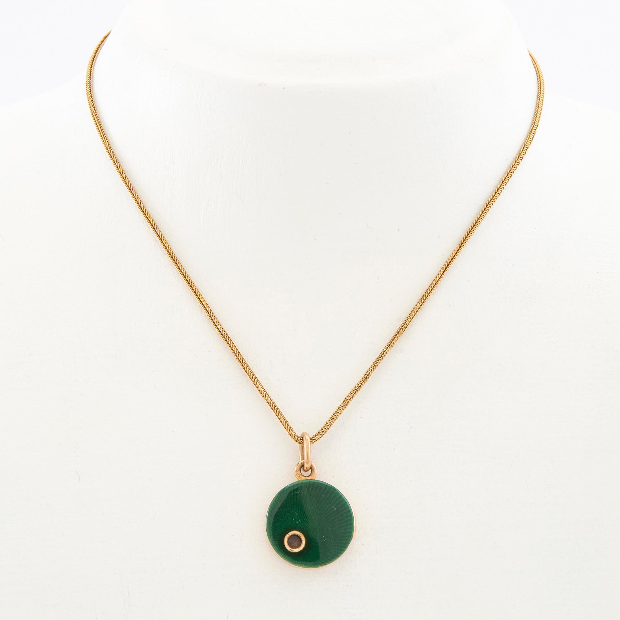 Halsband 18K guld med berlock.