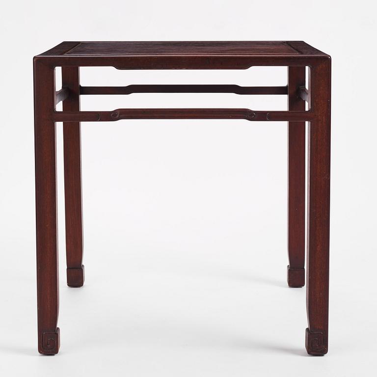 A Chinese hardwood corner-leg table, Qing dynasty.