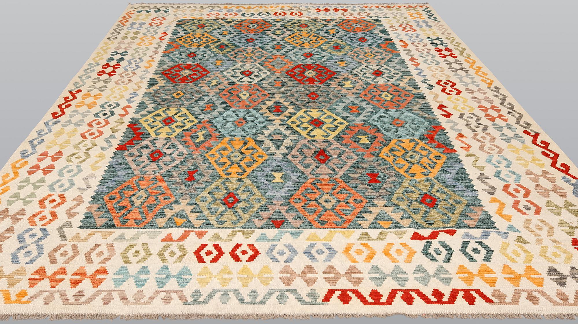 A Kelim carpet, c. 354 x 250 cm.