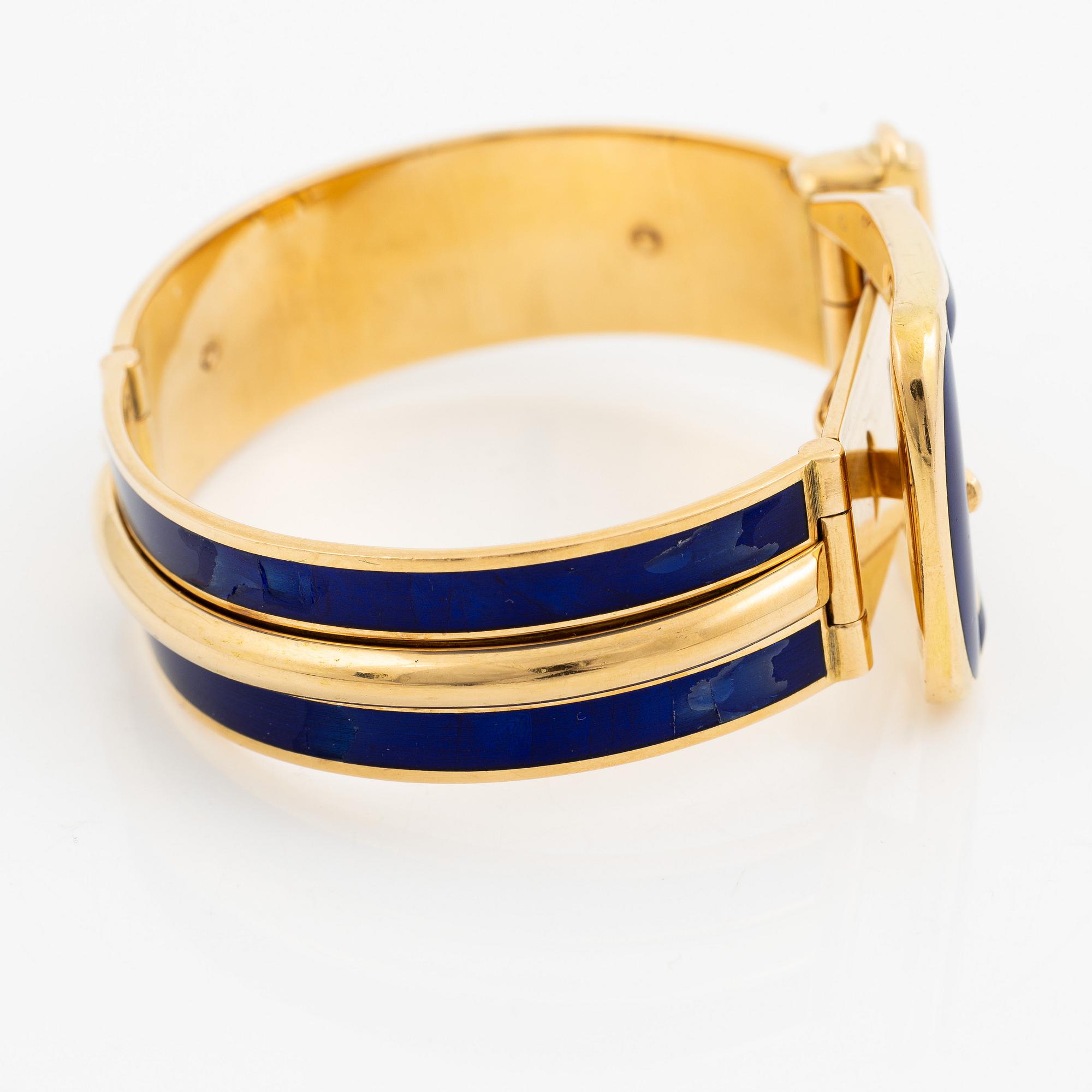 A Gucci bracelet 18K gold with blue enamel.