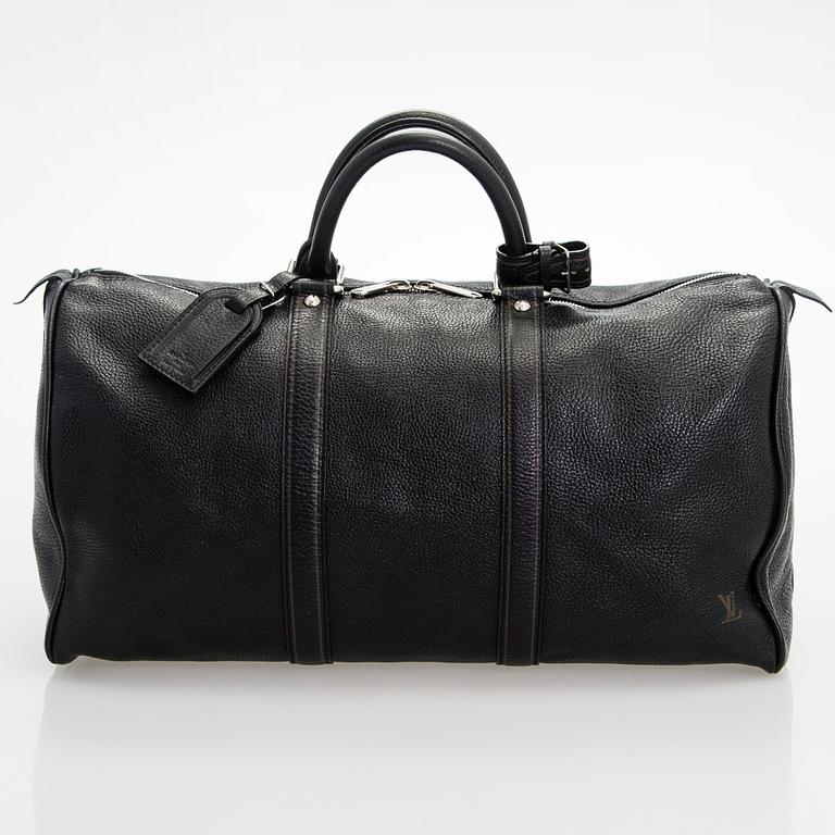 Louis Vuitton, a 'Keepall 50 Taurillon' leather weekend bag.
