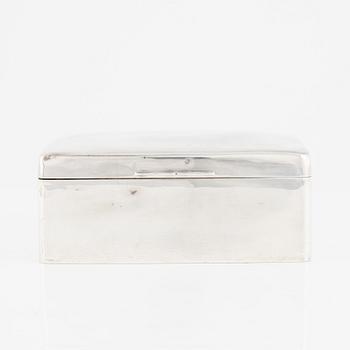 A silver cigarette box, Walker & Hall, Birmingham, England, 1919.