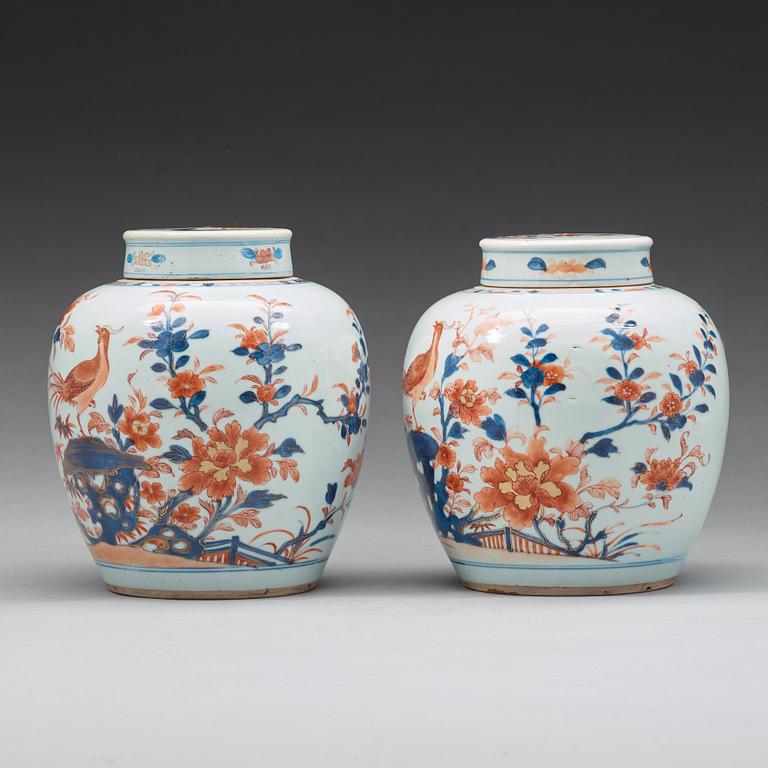 A pair of imari jars with covers, Qing dynasty, 18th Century.