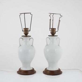 A pair of white porcelain table lamps / urns, Europe 20th century.