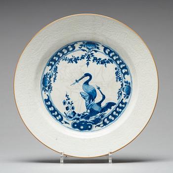 A blue and white armorial tureen with cover, and stand, Qing dynasty, 18th Century.