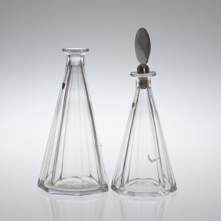 Two Wiwen Nilsson and Orrefors glass decanters, the one with a sterling stopper, Lund 1949.