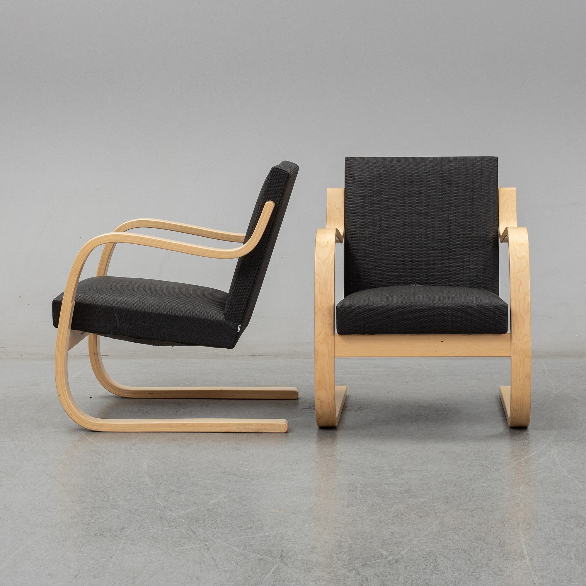 Alvar Aalto, a pair of model 406  birch armchairs, Artek, Finland, 2002.