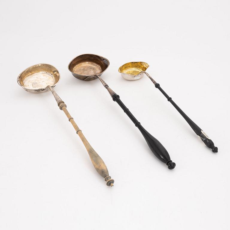 A set of three silver ladles, earlt 19th Century.