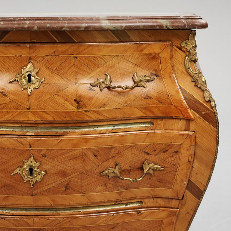 A parquetry and ormolu-mounted rococo commode by P. Gyllenberg (master in Stockholm 1767-85).