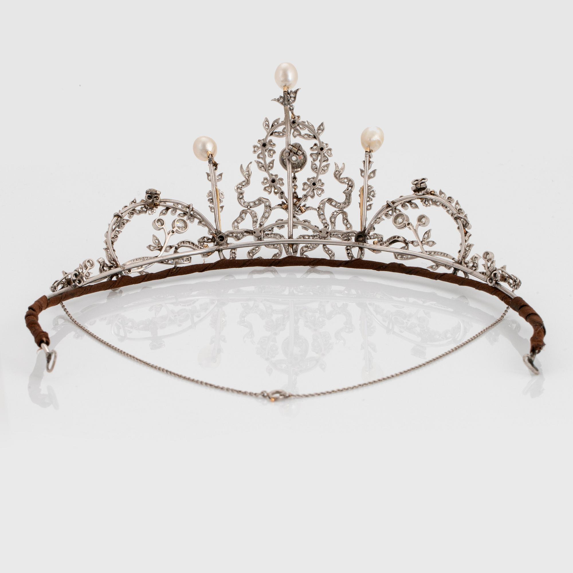 A platinum tiara/necklace combination set with old-cut diamonds and pearls.