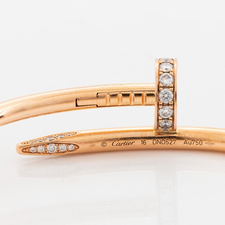 A Cartier "Juste en Clou" bracelet in 18K rose gold set with round brilliant-cut diamonds.