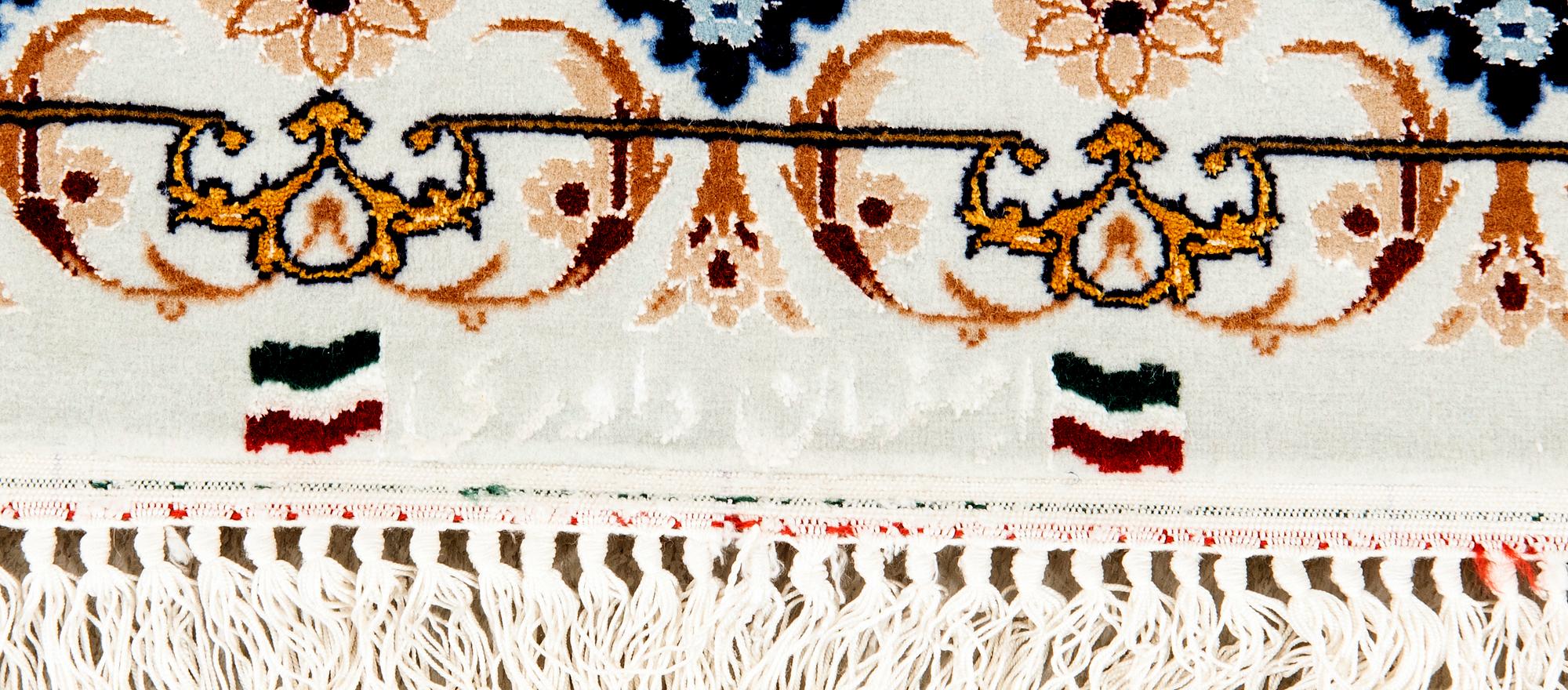 An old isfahan carpet part silk signed approx 222x148 cm.