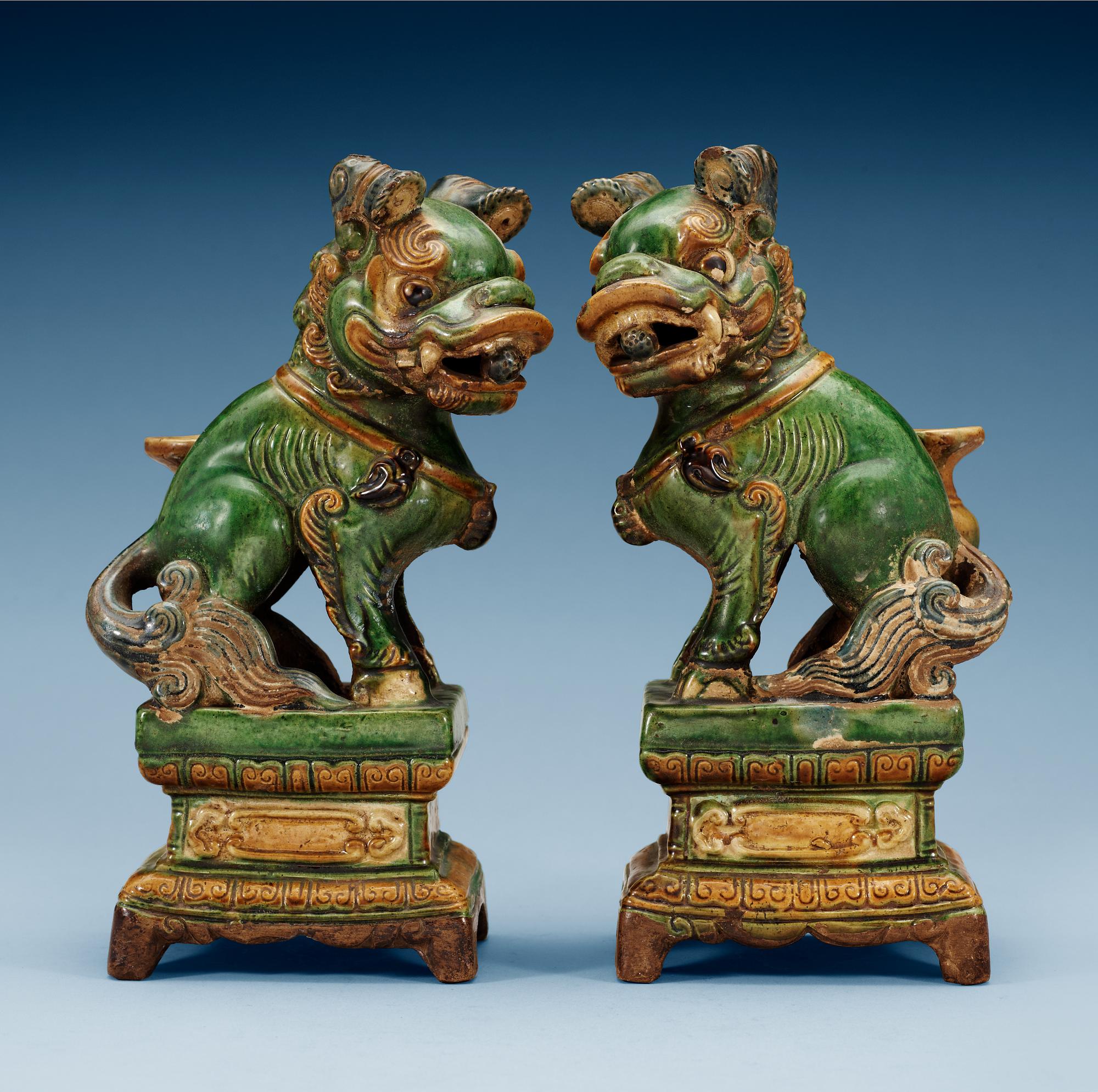 A pair of seated Buddhist lions, 17th Century.
