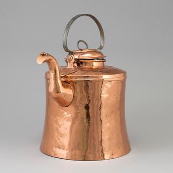 A 19th century copper pot with lid and handle.