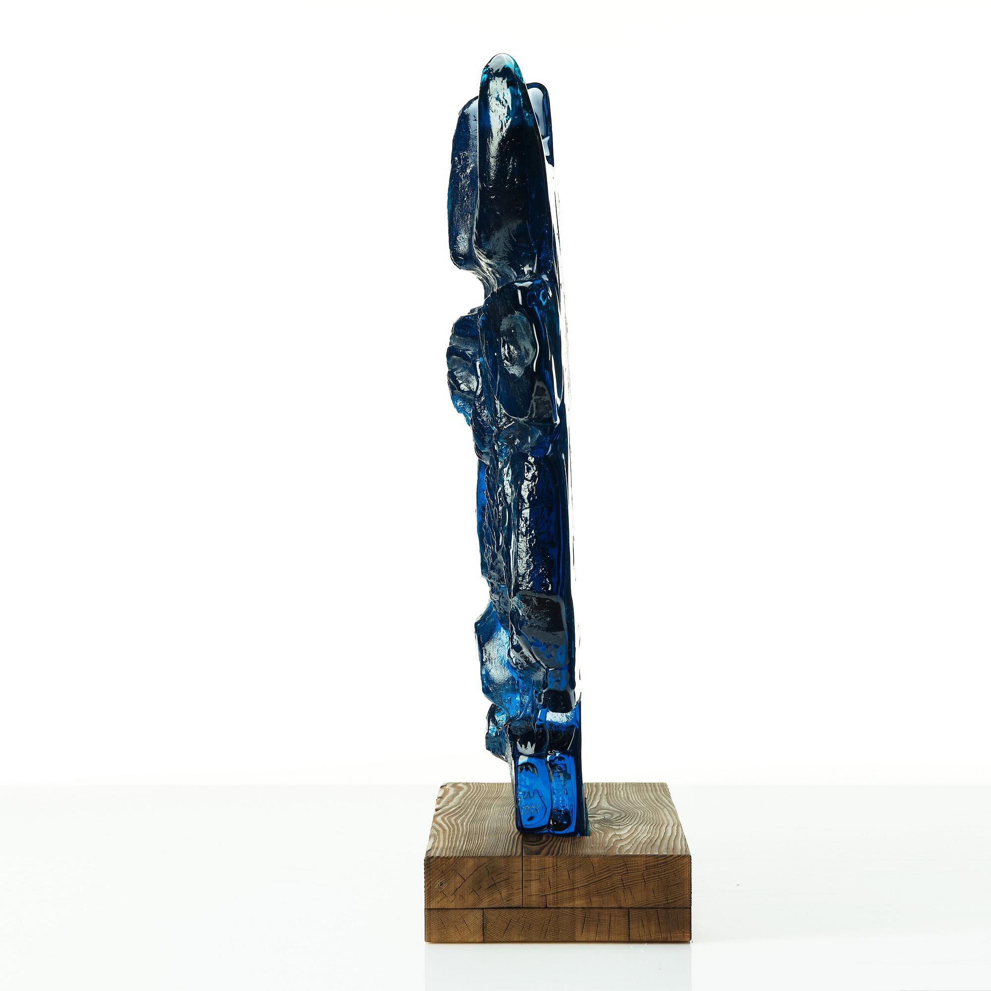 Edvin Öhrström, a blue/ turquoise coloured cast glass sculpture of a bull's head, Lindshammar glassworks, Sweden, signed and dated 1953.