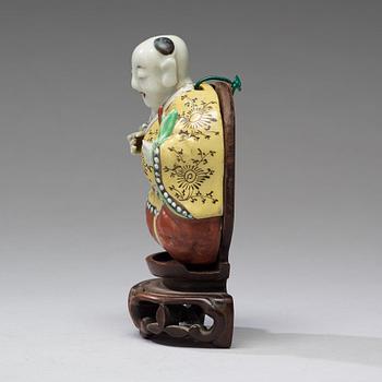 A famille rose wall figure, Qing dynasty, circa 1800.