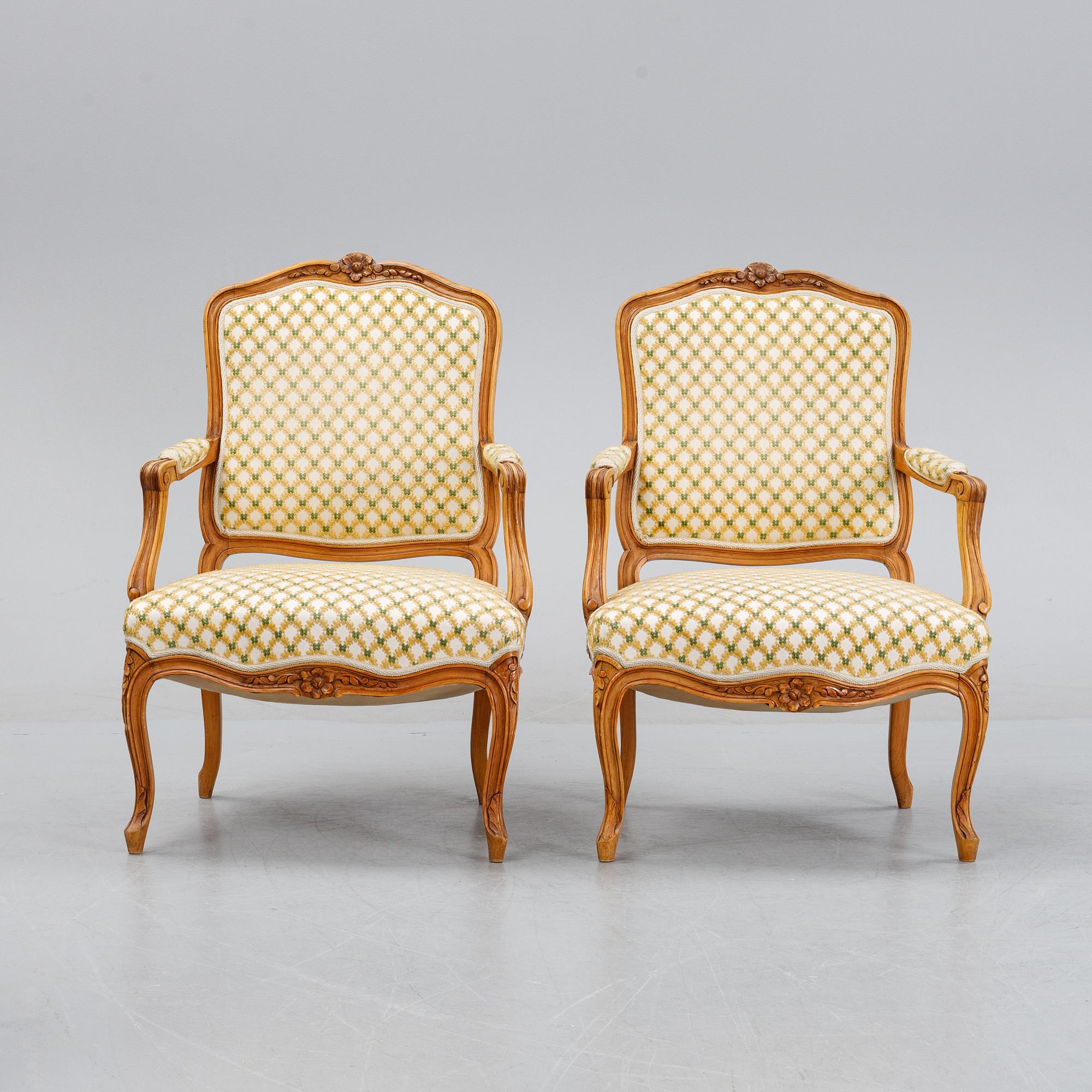 A pair of rococo style armchairs, early 20th Century.