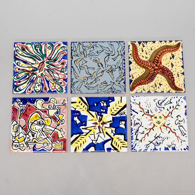 A set of six earthenware tile plates, after Salvador Dalí, late 20th century.