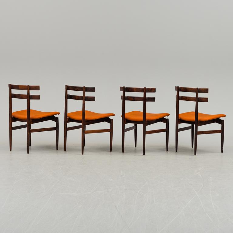 A dining table with four chairs by Poul Hundevad, latter part of 20th century.