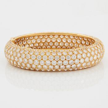 Cartier armring 18K guld med runda briljantslipade diamanter.