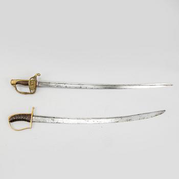 An end of the 18th Century Swedish sabre and a 19th century French century sabre, both with scabbards.