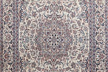 A carpet, Nain, part silk, ca 426 x 309 cm.