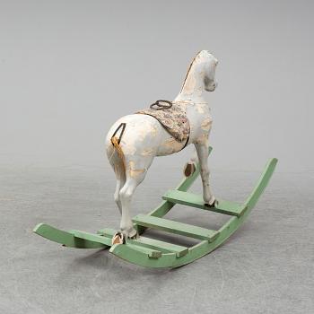 A wooden rocking horse from the early 20th century.