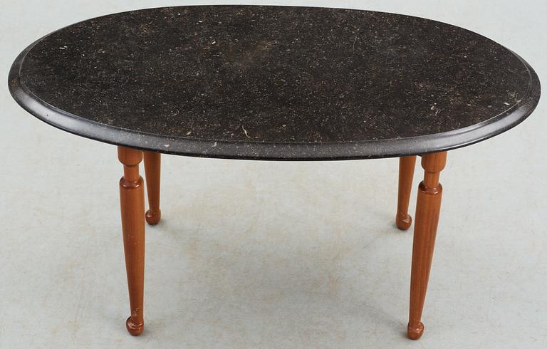 A Josef Frank black marble top and mahogany table by Svenskt Tenn.