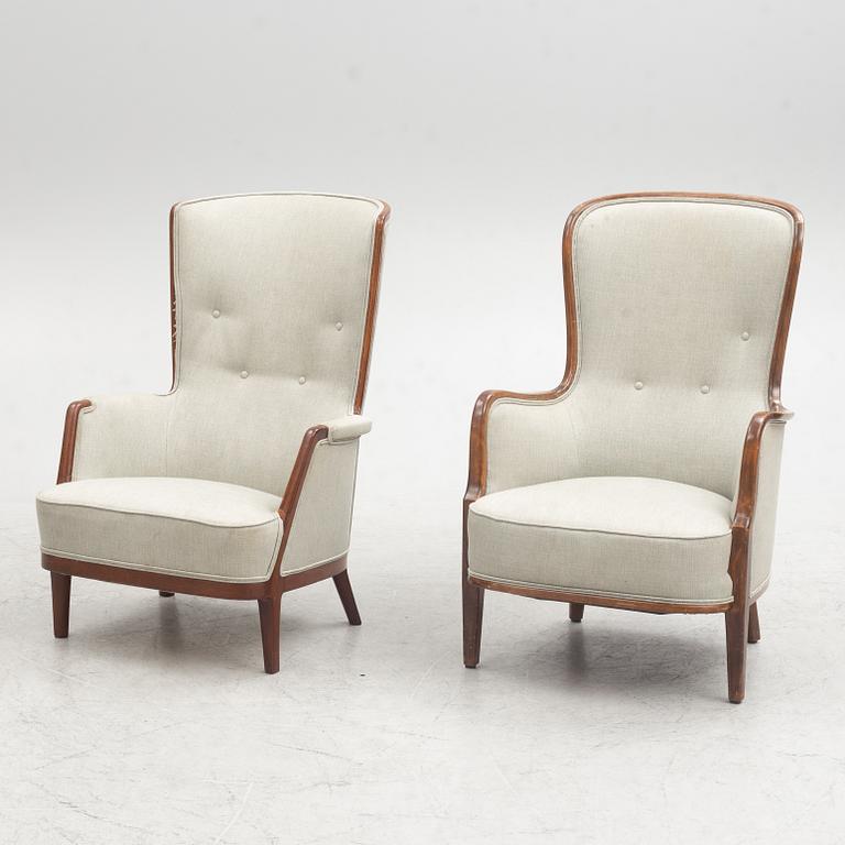 A pair of similar Swedish Modern armchairs, mid 20th century.