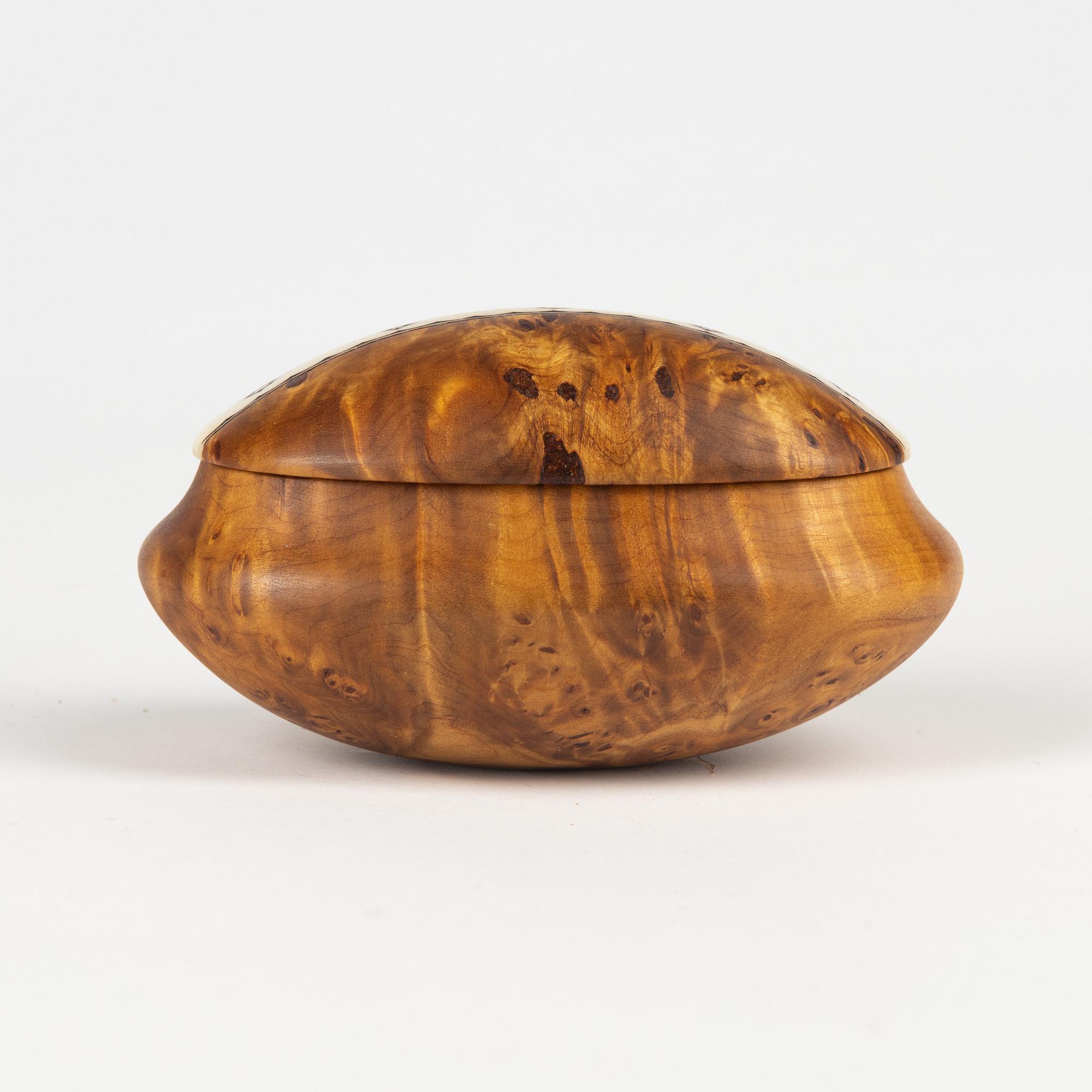 A small birch box by Martin Kuorak, signed.