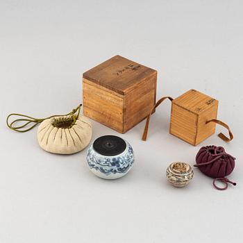 A group of two blue and white jars, one Korean, 19th century, the other Sawankalok, 13-14th century.